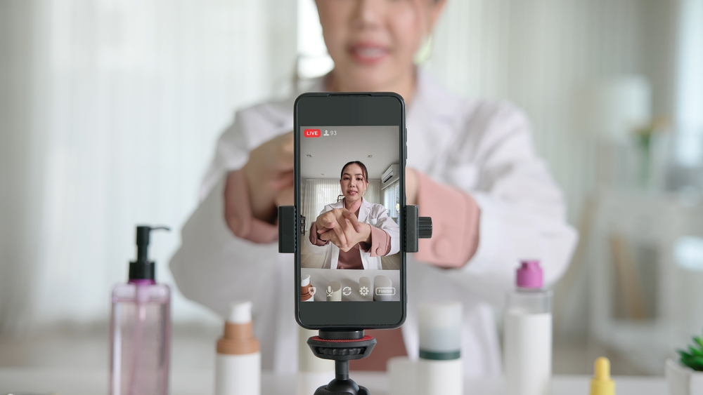 Content creator streaming a live Instagram video on a smartphone, showing how users analyze engagement and content trends using online Instagram viewer tools